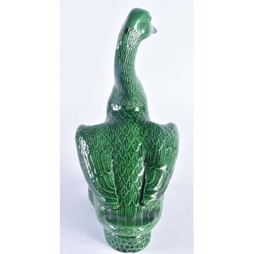 246 - A LARGE 19TH CENTURY CHINESE GREEN MONOCHROME PORCELAIN DUCK Kangxi style. 25.5 cm high.