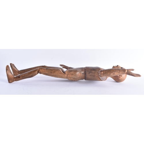 254 - A LARGE LATE 19TH CENTURY EUROPEAN CARVED PINE ARTISTS LAY DOLL with articulated arms and legs. 60 c... 