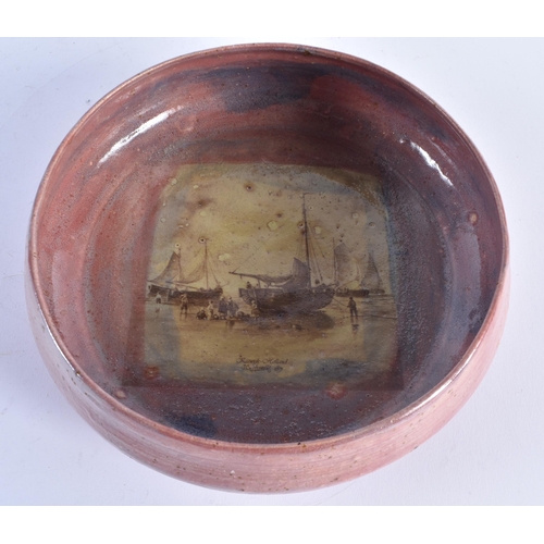 259 - A LARGE STUDIO POTTERY FLAMBE GLAZED BOWL painted with a Dutch Maritime scene. 25 cm diameter.