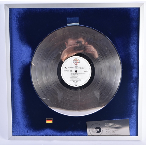 273 - AH-HA Hunting high and low German platinum disc presented to Andy Wickham to commemorate 500,000 sal... 