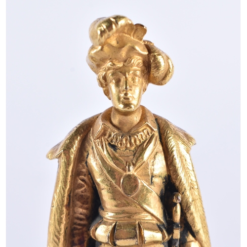 297 - AN EARLY 19TH CENTURY FRENCH ORMOLU AND MALACHITE FIGURE OF A CAVALIER modelled holding a skull. 15 ... 