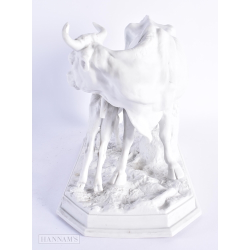 30 - A 19TH CENTURY EUROPEAN PARIAN BISQUE PORCELAIN FIGURE OF A COW AND CALF modelled upon a naturalisti... 