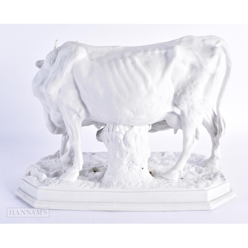 30 - A 19TH CENTURY EUROPEAN PARIAN BISQUE PORCELAIN FIGURE OF A COW AND CALF modelled upon a naturalisti... 