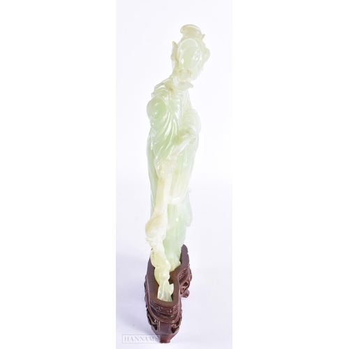 32 - A LARGE EARLY 20TH CENTURY CHINESE CARVED JADE FIGURE OF AN IMMORTAL Late Qing. 27 cm x 12 cm.