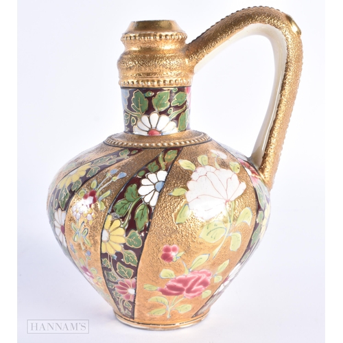 36 - AN ANTIQUE HUNGARIAN FISCHER JUG painted with flowers on a raised gilt ground. 17 cm high.