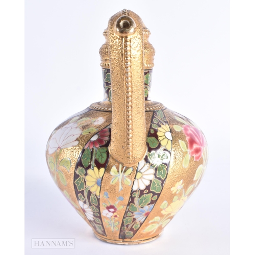 36 - AN ANTIQUE HUNGARIAN FISCHER JUG painted with flowers on a raised gilt ground. 17 cm high.