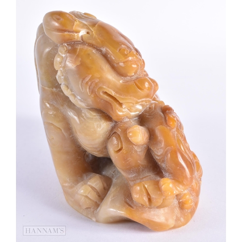 37 - A 19TH CENTURY CHINESE CARVED SOAPSTONE FIGURE OF A BUDDHIST LION possibly Tianhuang. 15.5 cm x 11 c... 