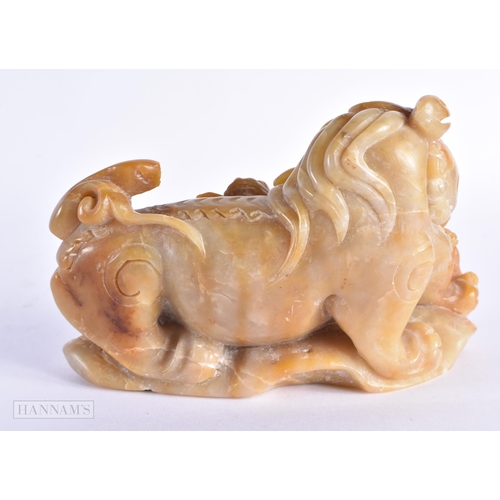 37 - A 19TH CENTURY CHINESE CARVED SOAPSTONE FIGURE OF A BUDDHIST LION possibly Tianhuang. 15.5 cm x 11 c... 