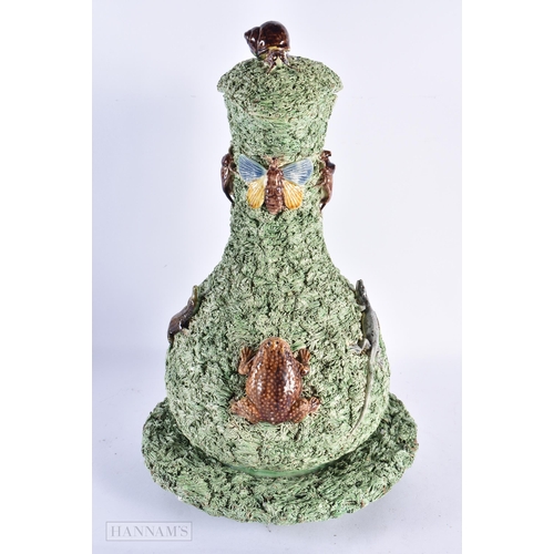 41 - A LOVELY LARGE PORTUGUESE MAJOLICA POTTERY EWER COVER AND STAND mounted with toads, insects and liza... 