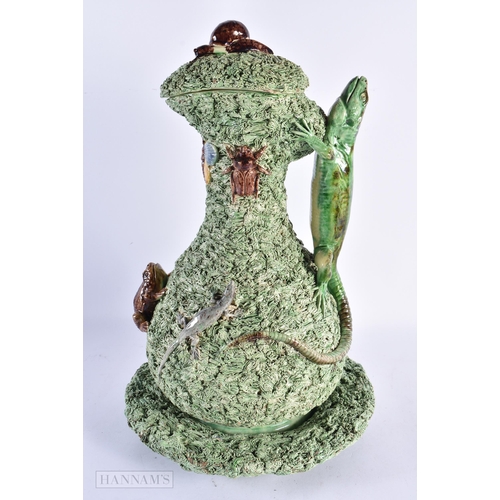 41 - A LOVELY LARGE PORTUGUESE MAJOLICA POTTERY EWER COVER AND STAND mounted with toads, insects and liza... 