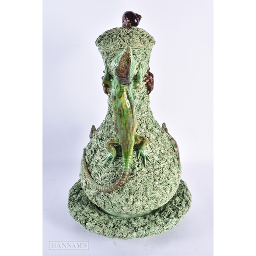 41 - A LOVELY LARGE PORTUGUESE MAJOLICA POTTERY EWER COVER AND STAND mounted with toads, insects and liza... 