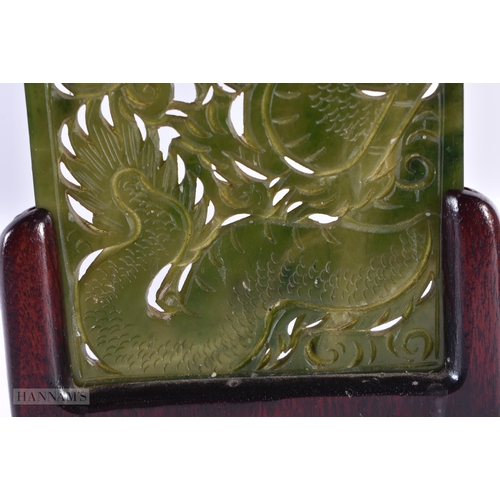 47 - A 19TH CENTURY CHINESE CARVED SPINACH JADE RECTANGULAR PLAQUE Qing, decorated with a dragon. 16 cm x... 