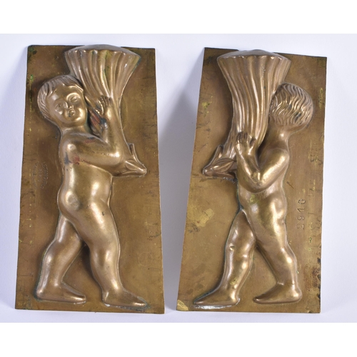 472 - Letang Fils Paris Antique Brass Confectunary Mould Putto Holding Cornucopia. 19 cm x 10 cm. (2)