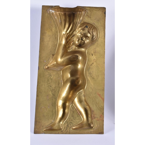 472 - Letang Fils Paris Antique Brass Confectunary Mould Putto Holding Cornucopia. 19 cm x 10 cm. (2)