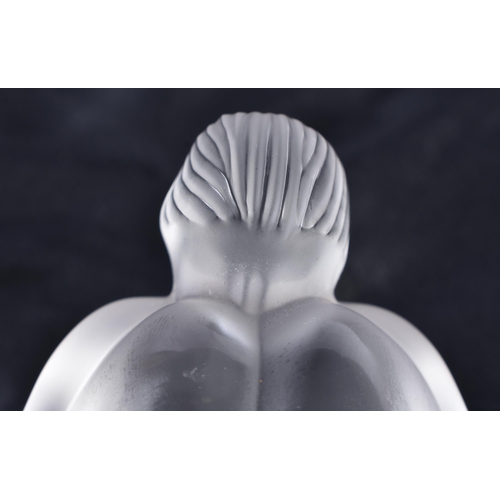 481 - A LALIQUE GLASS SLEEPING NUDE. 8 cm wide.