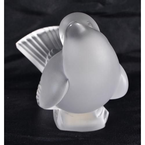 495 - A LALIQUE GLASS BIRD. 10 cm wide.