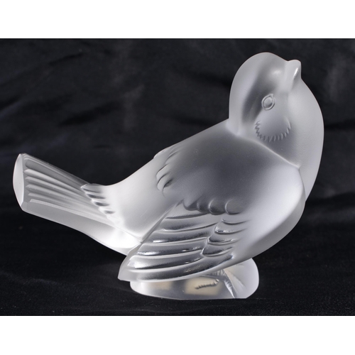 495 - A LALIQUE GLASS BIRD. 10 cm wide.