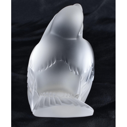 495 - A LALIQUE GLASS BIRD. 10 cm wide.