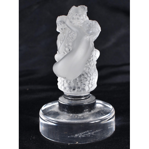 499 - A LALIQUE GLASS NUDE AND GRAPE FIGURE. 8.5 cm high.