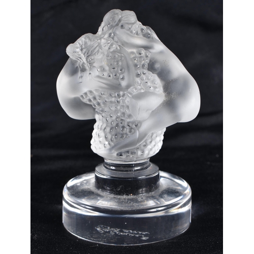 499 - A LALIQUE GLASS NUDE AND GRAPE FIGURE. 8.5 cm high.