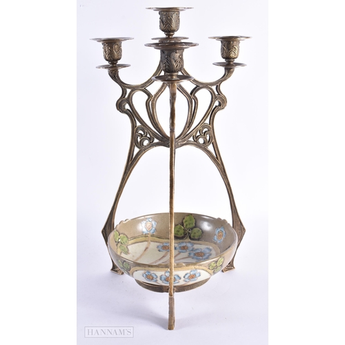 50 - AN ART NOUVEAU CONTINENTAL BRONZE AND CERAMIC TRIPLE BRANCH CANDELABRA decorated with flowers. 44 cm... 