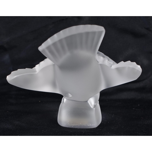 501 - A LALIQUE GLASS BIRD. 11 cm wide.