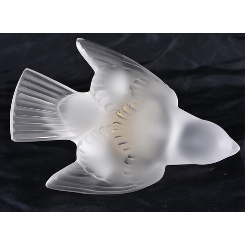 501 - A LALIQUE GLASS BIRD. 11 cm wide.