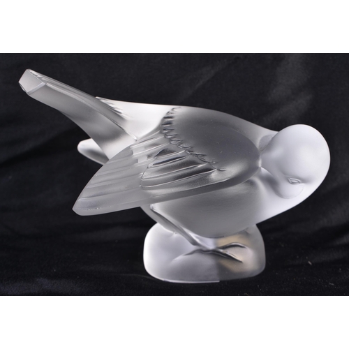 505 - A LALIQUE GLASS BIRD. 10 cm wide.