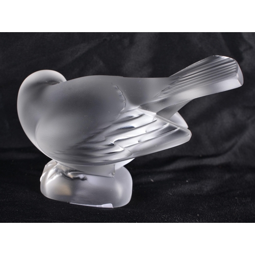 505 - A LALIQUE GLASS BIRD. 10 cm wide.