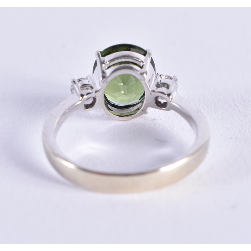 510 - AN 18CT GOLD DIAMOND AND GREEN SAPPHIRE RING. 4 grams.