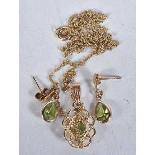 523 - A 9 Carat Gold Peridot Pendant Necklace with Matching Earrings.  Stamped 375,  Pendant 2.2cm x 1 cm,... 