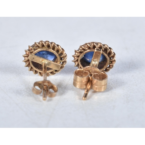 528 - A Pair of 9 Carat Gold Sapphire Stud Earrings.  Stamped 375.  0.8 cm diameter, weight 1.1g