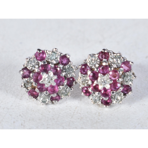 530 - A Pair of 9 Carat Gold Ruby & Diamond Cluster Earrings.  Stamped 9CT, 0.9cm diameter, weight 1.6g