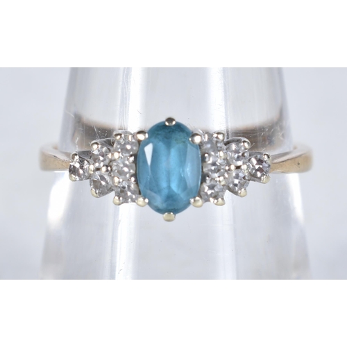 539 - A 9 Carat Gold Blue Topaz & Diamond Dress Ring.  Stamped 375.  Size N, weight 1.9g