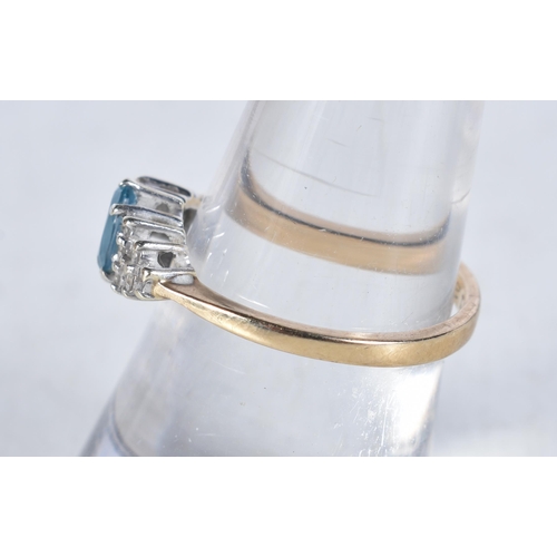 539 - A 9 Carat Gold Blue Topaz & Diamond Dress Ring.  Stamped 375.  Size N, weight 1.9g