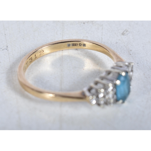 539 - A 9 Carat Gold Blue Topaz & Diamond Dress Ring.  Stamped 375.  Size N, weight 1.9g