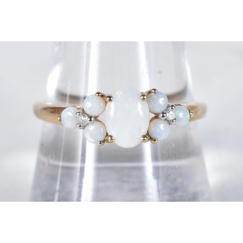 548 - A 9 Carat Gold Opal & Diamond Dress Ring.  Stamped 375, Size S, weight 1.6g