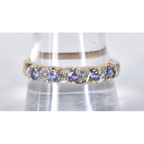 549 - A 9 Carat Gold Tanzanite & Diamond Half Eternity Ring.  Stamped 375, Size T, weight 2.3g