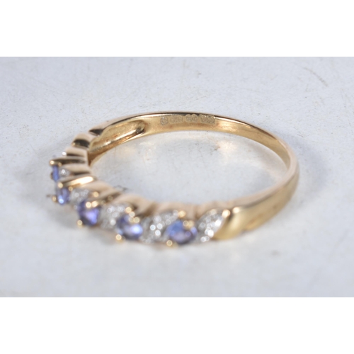 549 - A 9 Carat Gold Tanzanite & Diamond Half Eternity Ring.  Stamped 375, Size T, weight 2.3g