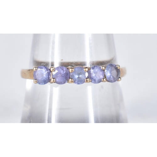 551 - A 9 Carat Gold Tanzanite Five Stone Ring.  Stamped 9K.  Size P, weight 1.6g