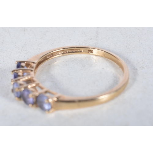 551 - A 9 Carat Gold Tanzanite Five Stone Ring.  Stamped 9K.  Size P, weight 1.6g