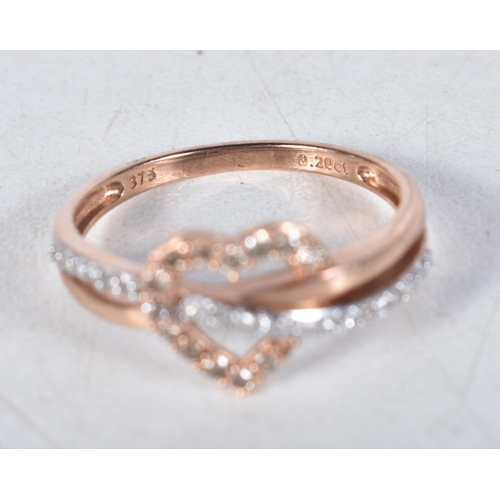 553 - A 9 Carat Gold Diamond Heart Shape Ring.  Stamped 375.  Total Diamond Weight: 0.20ct (approximately)... 