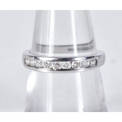 555 - A 9 Carat Gold Diamond Half Eternity Ring.  Stamped 375.  Size L, weight 1.8g