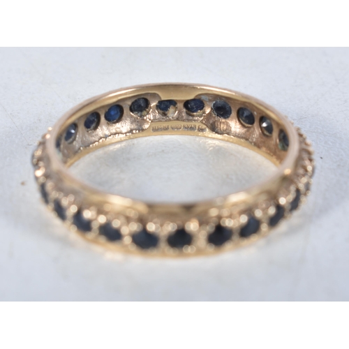 559 - A 9 Carat Gold Sapphire Full Eternity Ring.  Stamped 375.  Size S, weight 2.5g