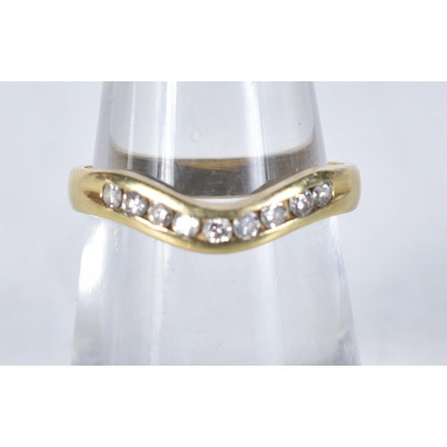 560 - An 18 Carat Gold Diamond Curved Wishbone Ring.  Stamped 750.  Size L, weight 2.4g