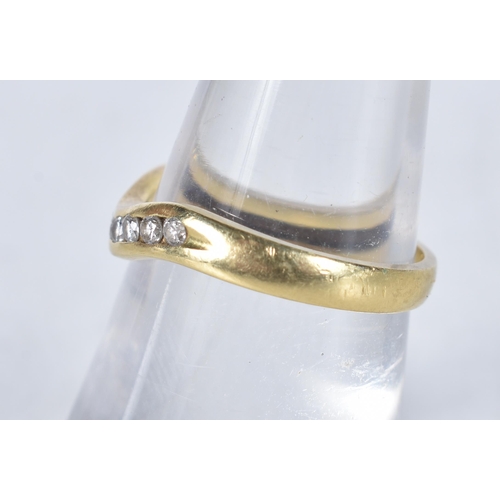 560 - An 18 Carat Gold Diamond Curved Wishbone Ring.  Stamped 750.  Size L, weight 2.4g