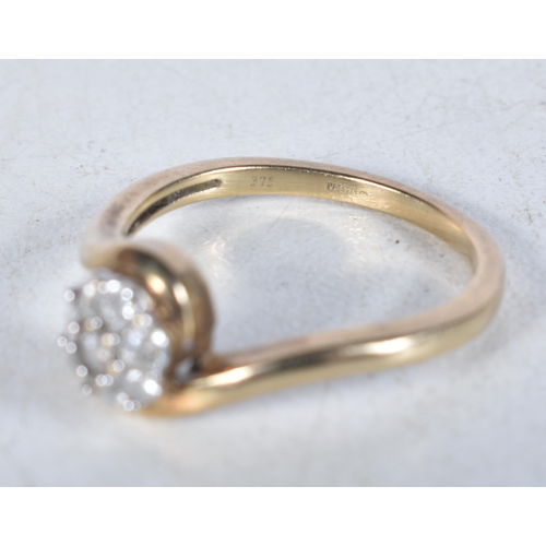 561 - A 9 Carat Gold Diamond Cluster Ring.  Total Diamond Weight: 0.25ct (approximately).  Stamped 375.  S... 