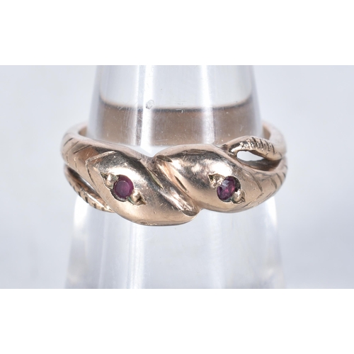 562 - A 9 Carat Gold Vintage Ruby Double Coiled Snake Ring.  Size L/M, weight 4.1g