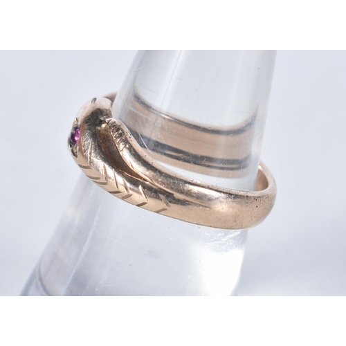 562 - A 9 Carat Gold Vintage Ruby Double Coiled Snake Ring.  Size L/M, weight 4.1g