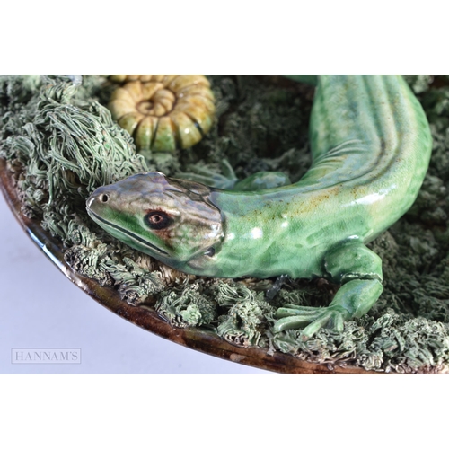 57 - AN ANTIQUE PORTUGUESE MAJOLICA POTTERY LIZARD DISH encrusted with shells and toads. 19 cm wide.